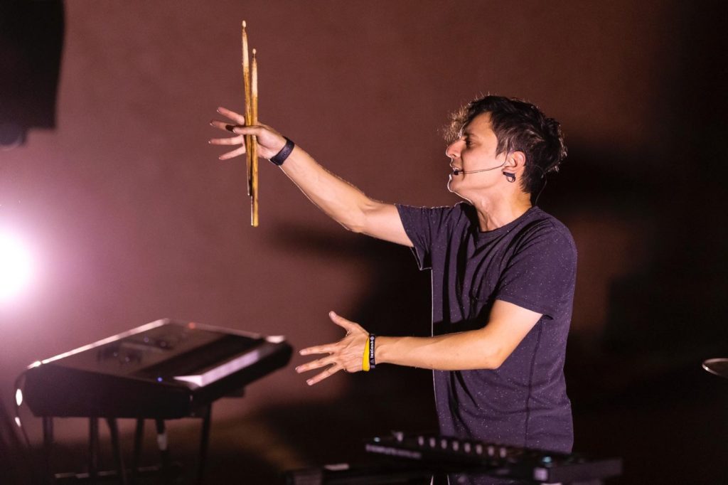 Musician playing with drumsticks